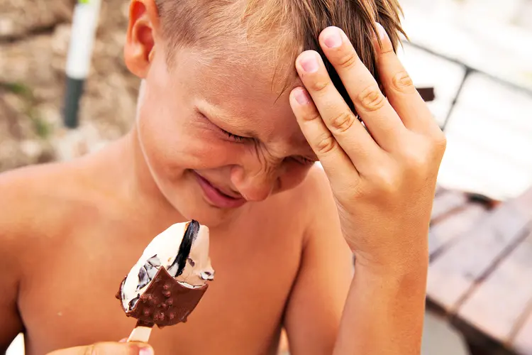 photo of young boy with ice cream headache