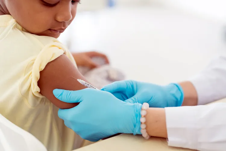 photo of young boy receiving vaccination