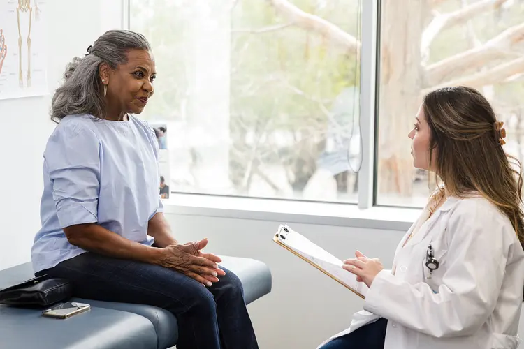 photo of doctor talking to patient