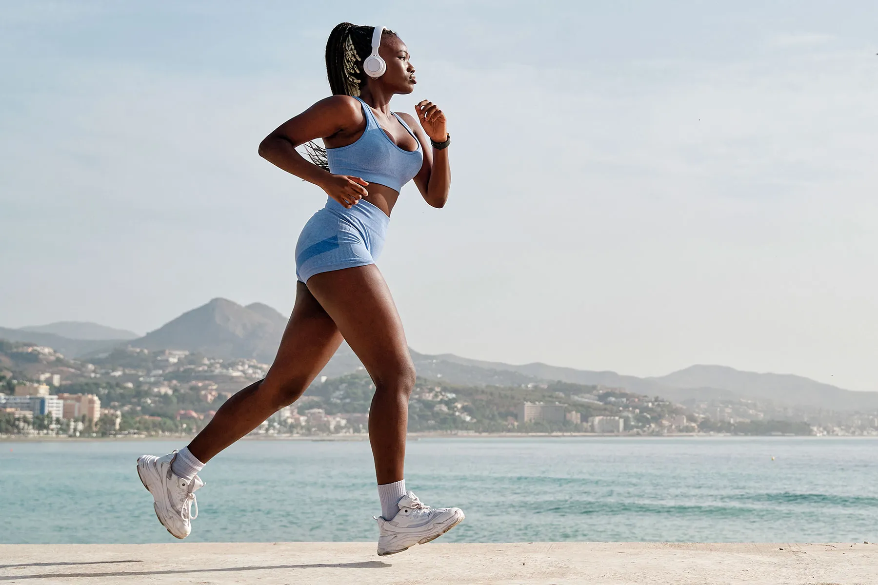 photo of young black female athlete running