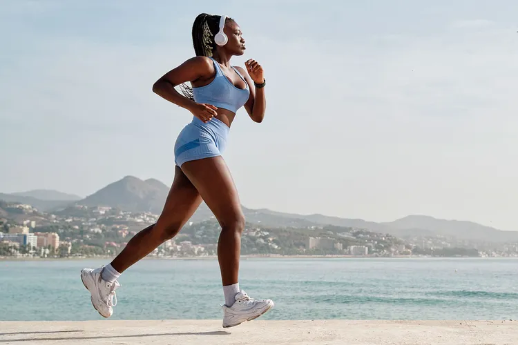 photo of young black female athlete running