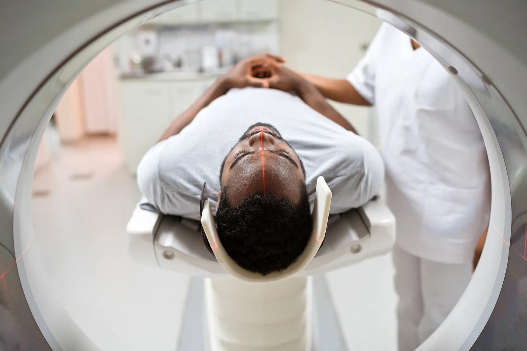 photo of man undergoing MRI scan