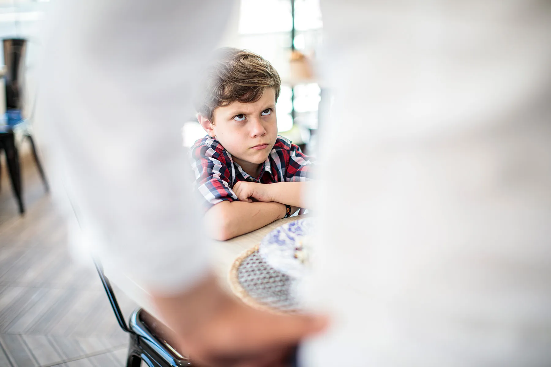 photo of child looking angrily at parent