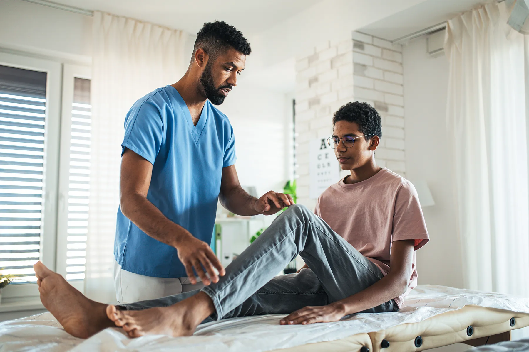 photo of  orthopedic surgeon doing manual therapy