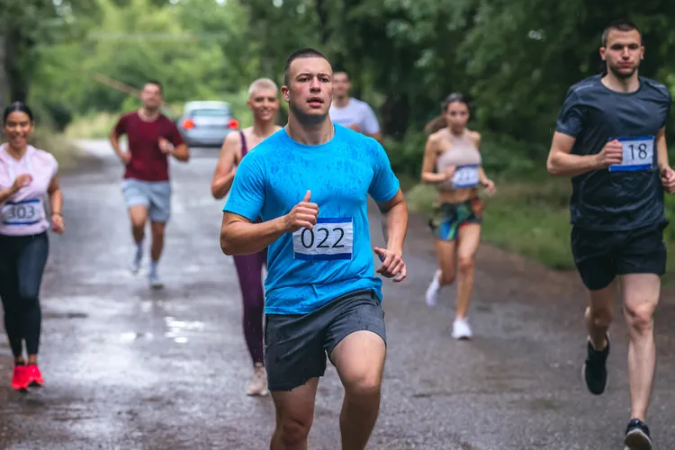 photo of man running in marathon