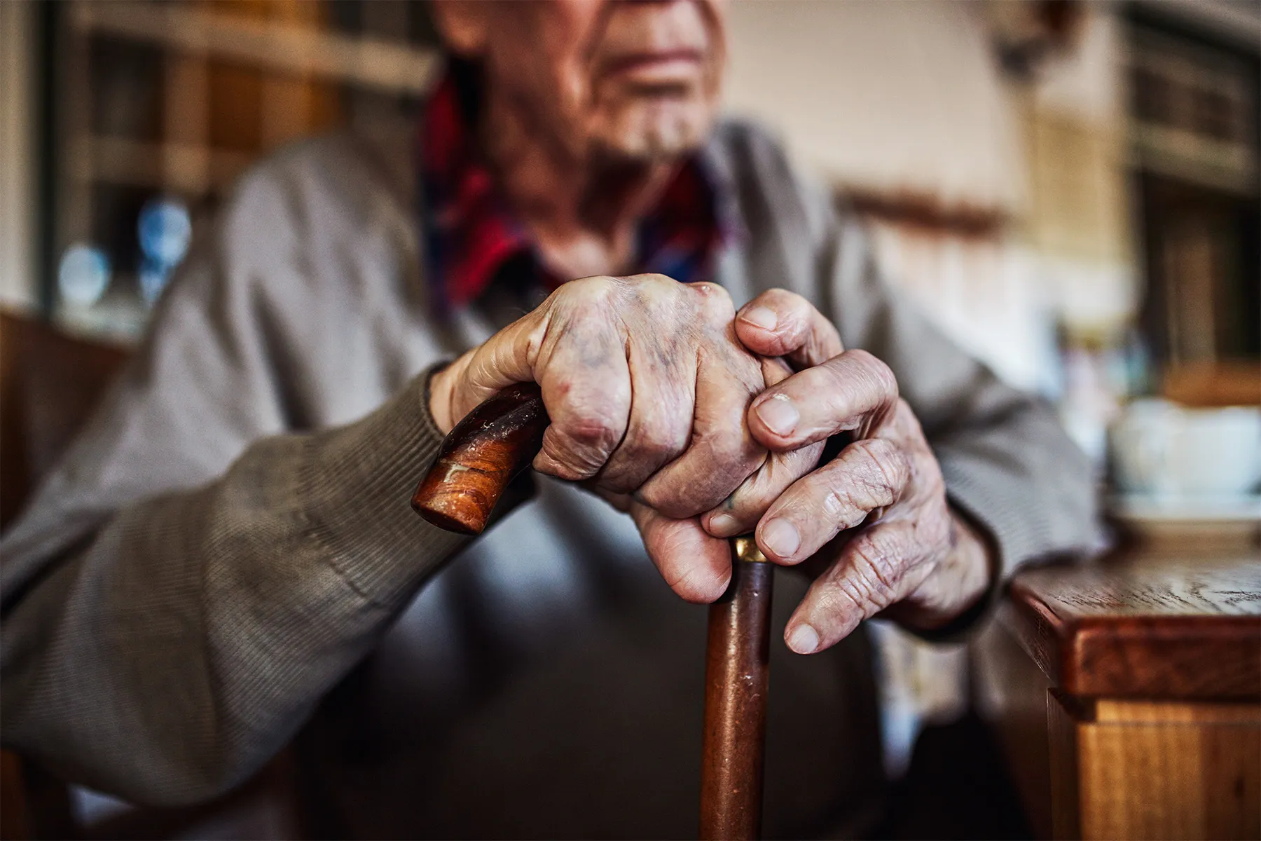 photo of senior man using walker
