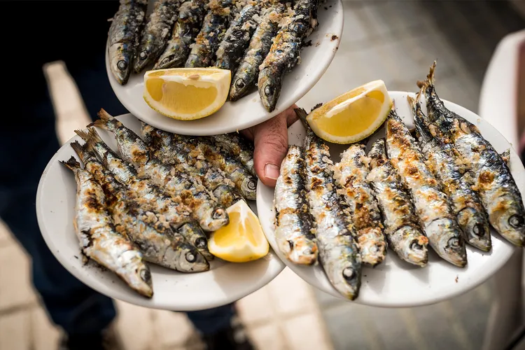 photo of Plates of grilled sardines 
