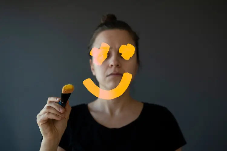 photo of woman drawing smiley face