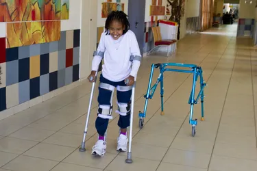 People with spina bifida may use a range of walking aids, including braces, canes, and walkers. (Photo Credit: Corbis Documentary/Getty Images)