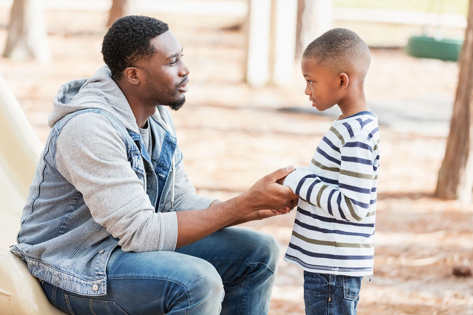 photo of father talking to son