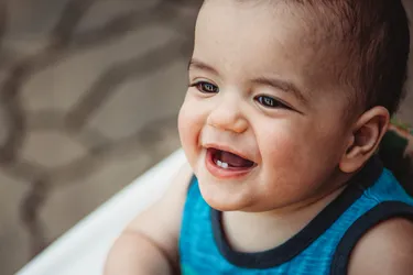 Teething is when your baby’s teeth start to come through their gumline. When a baby’s teeth start to emerge, it can be uncomfortable. Most babies begin to teethe between 4 and 7 months old, but some start much later. (Photo Credit: Moment/Getty Images)