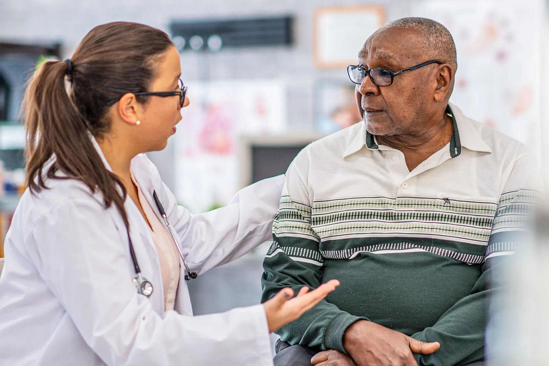 photo of Senior man talking to doctor