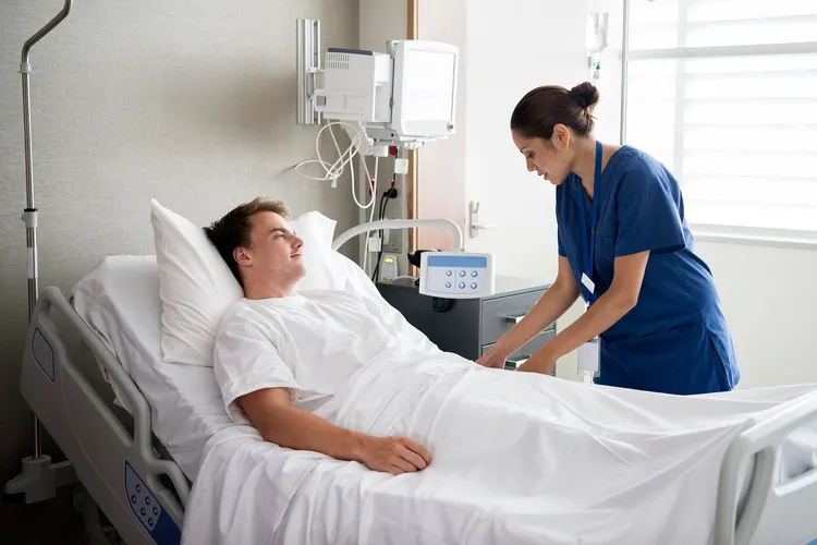 photo of young man in hospital bed