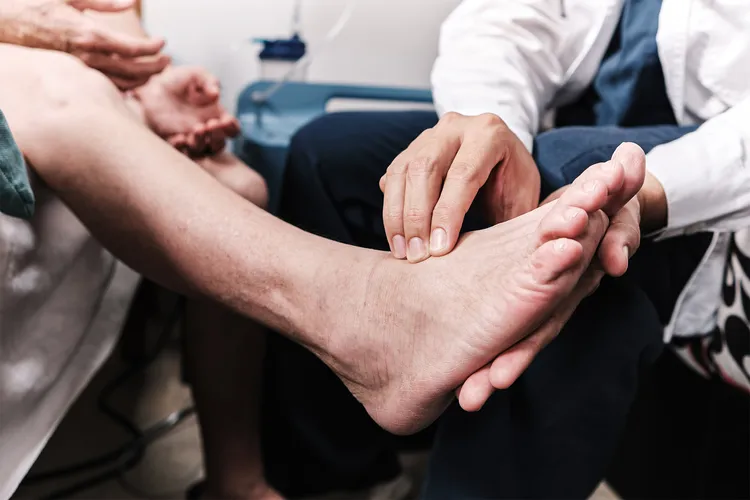 photo of doctor examining a patient's foot