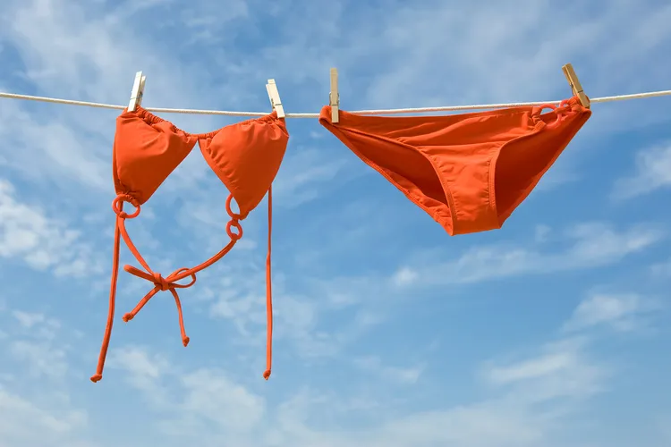 photo of bikini drying on clothesline