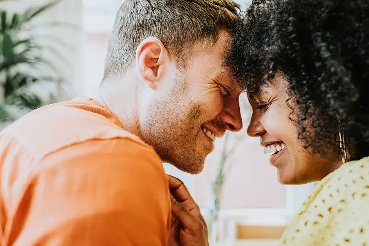 photo of couple giggle and smile