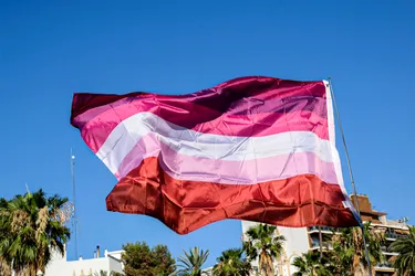 There are two versions of the lesbian flag. One has seven stripes, and the other has five. It was created in 2018. (Photo Credit: Moment RF/Getty Images)
