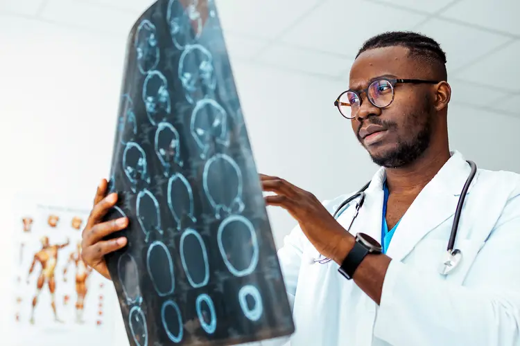 photo of doctor reviewing cranial  X-rays
