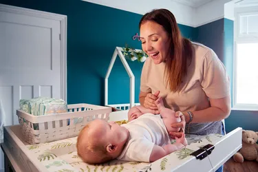 If you want a designated space to change your baby's diaper, wooden changing tables with guardrails are usually the safest and most stable choice. (Photo credit: iStock/Getty Images)