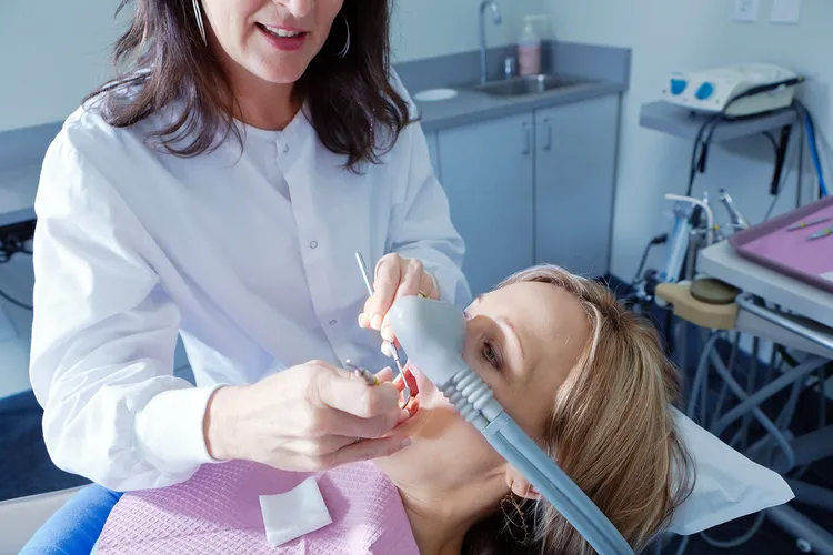 photo of dental hygienist with patient