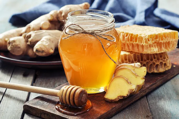 photo of Honey in jar with fresh ginger 