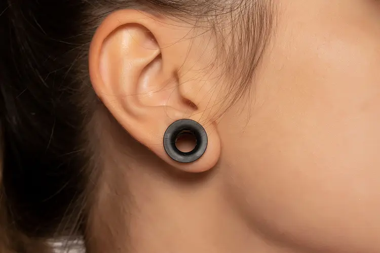 photo of ear stretching