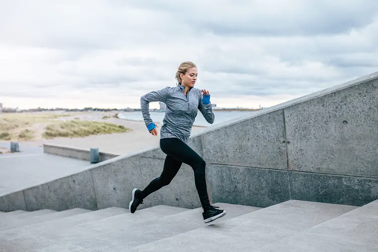 photo of Runner running on stairs