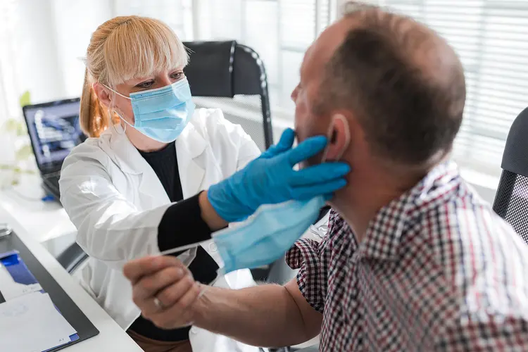 photo of Female doctor doing a full mouth exam