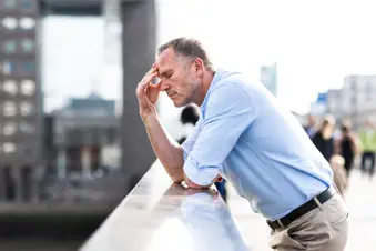 photo of man having headache