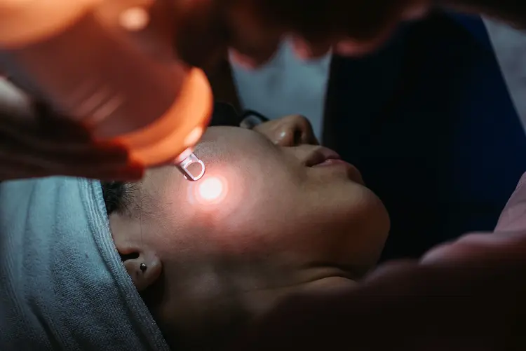 photo of woman getting laser treatment on face