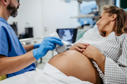 photo of Woman having sonogram
