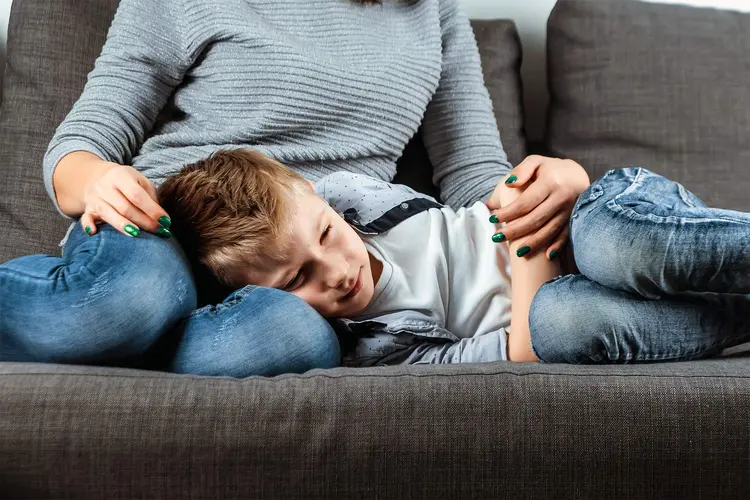 photo of boy with abdominal pain