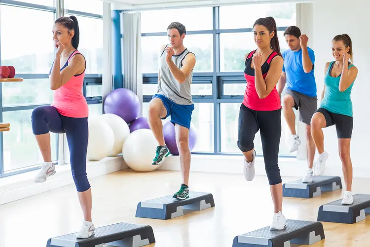 photo of step aerobics exercise in gym