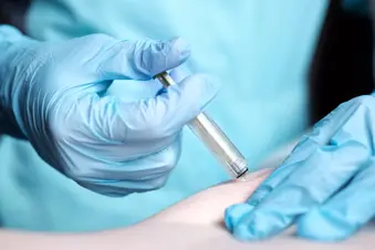 photo of healthcare provider administering abdominal injection