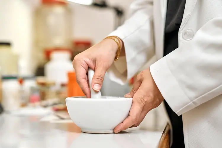 photo of pharmacist preparing medicinal compound