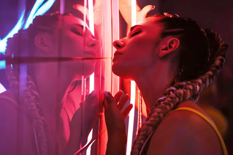 photo of woman kissing herself in mirror