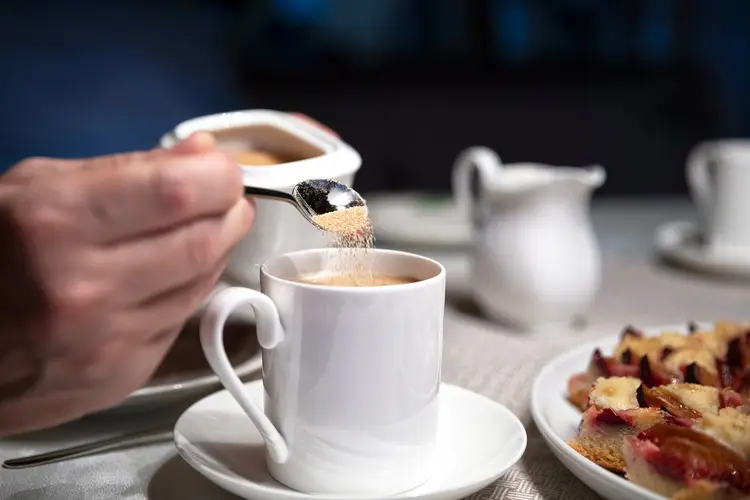 photo of adding brown sugar to coffee