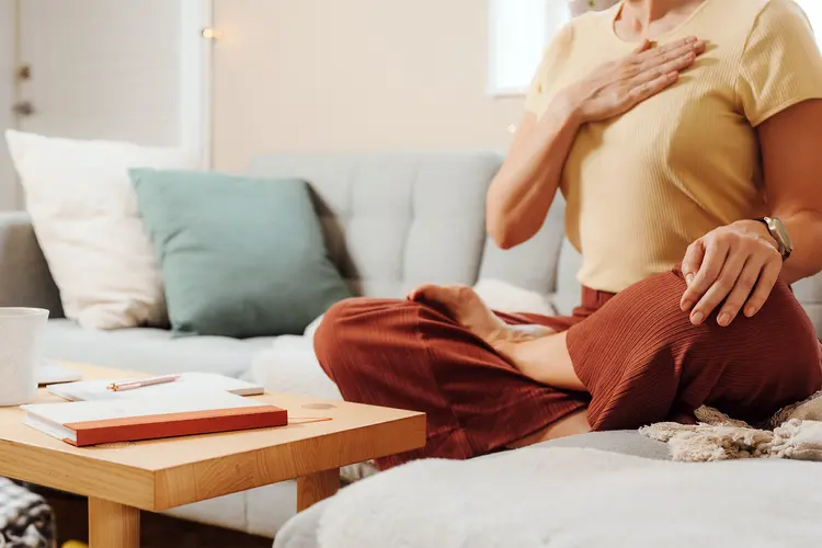 photo of woman meditating doing breathing exercise
