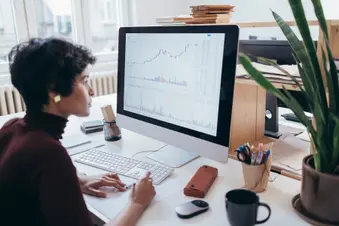 photo of woman working on computer