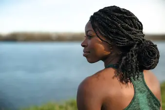 photo of young woman by river