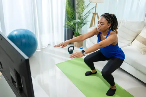 photo of woman doing a squat