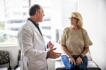 photo of senior woman talking with doctor