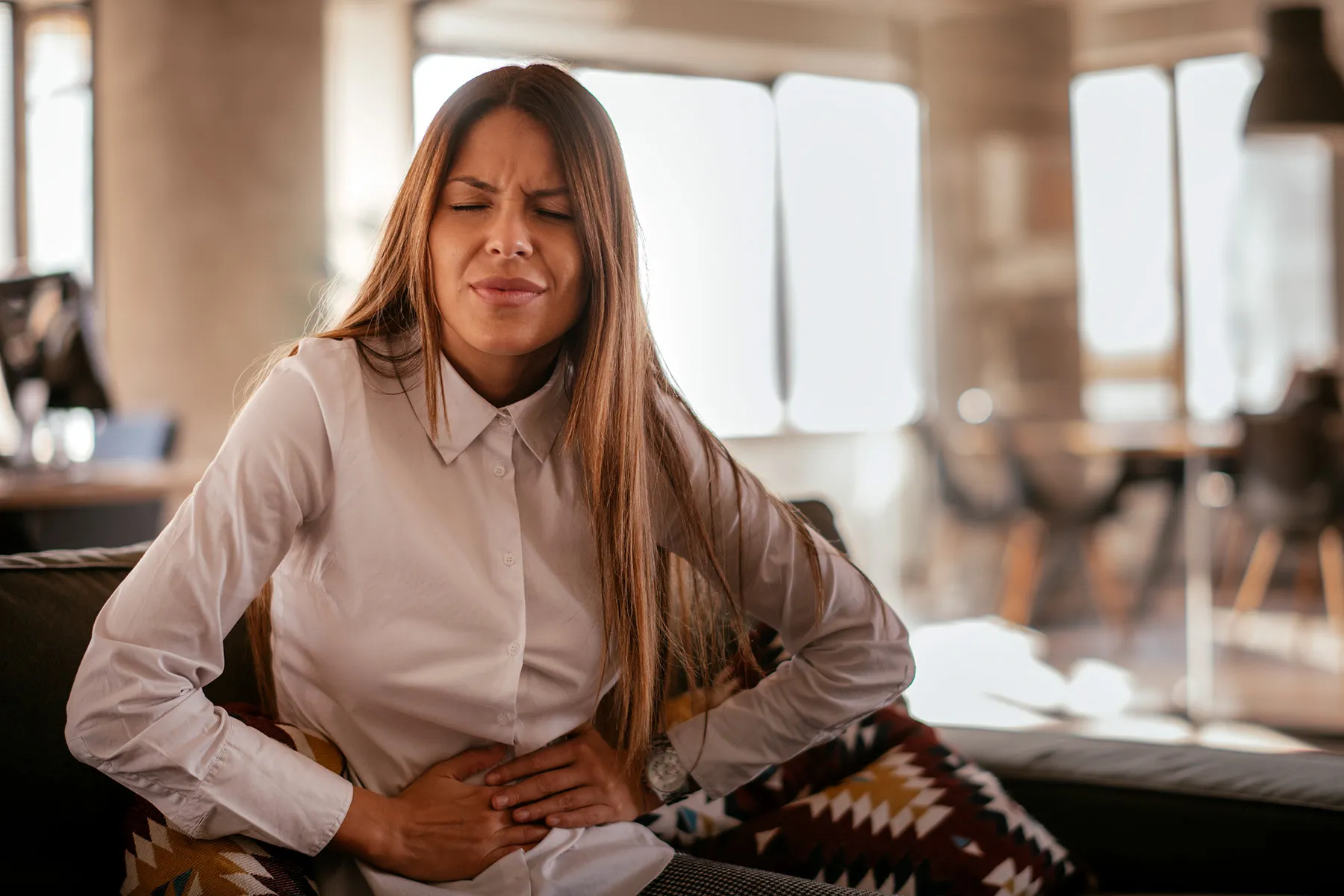 photo of woman with stomachache