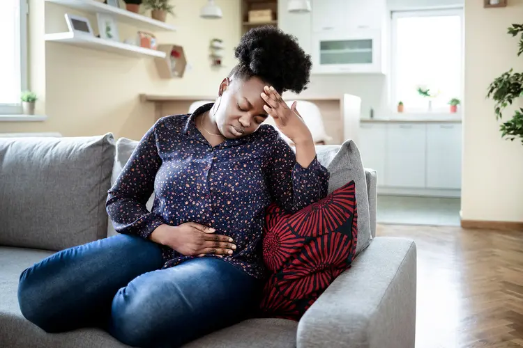photo of sick young african american woman,