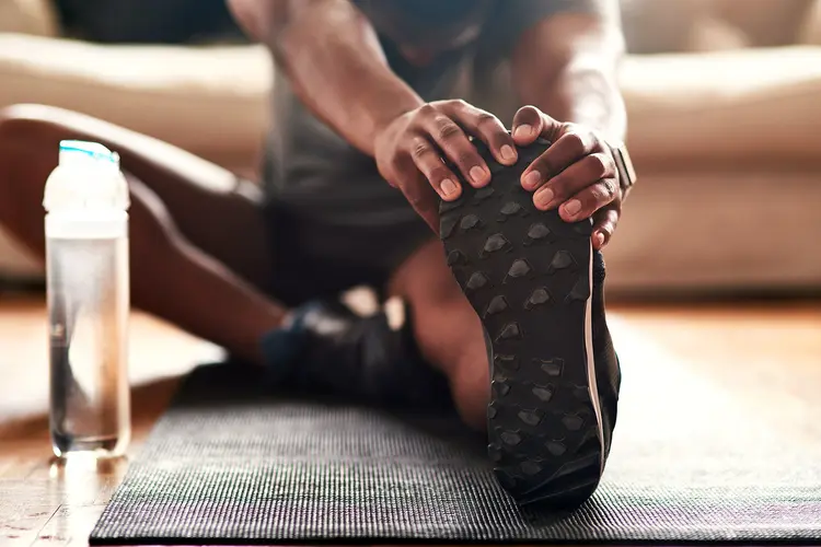 photo of man doing morning stretch at home