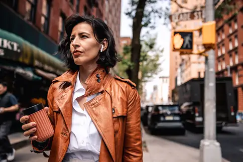 photo of woman walking in New York City