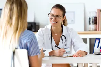 photo of doctor talking with patient