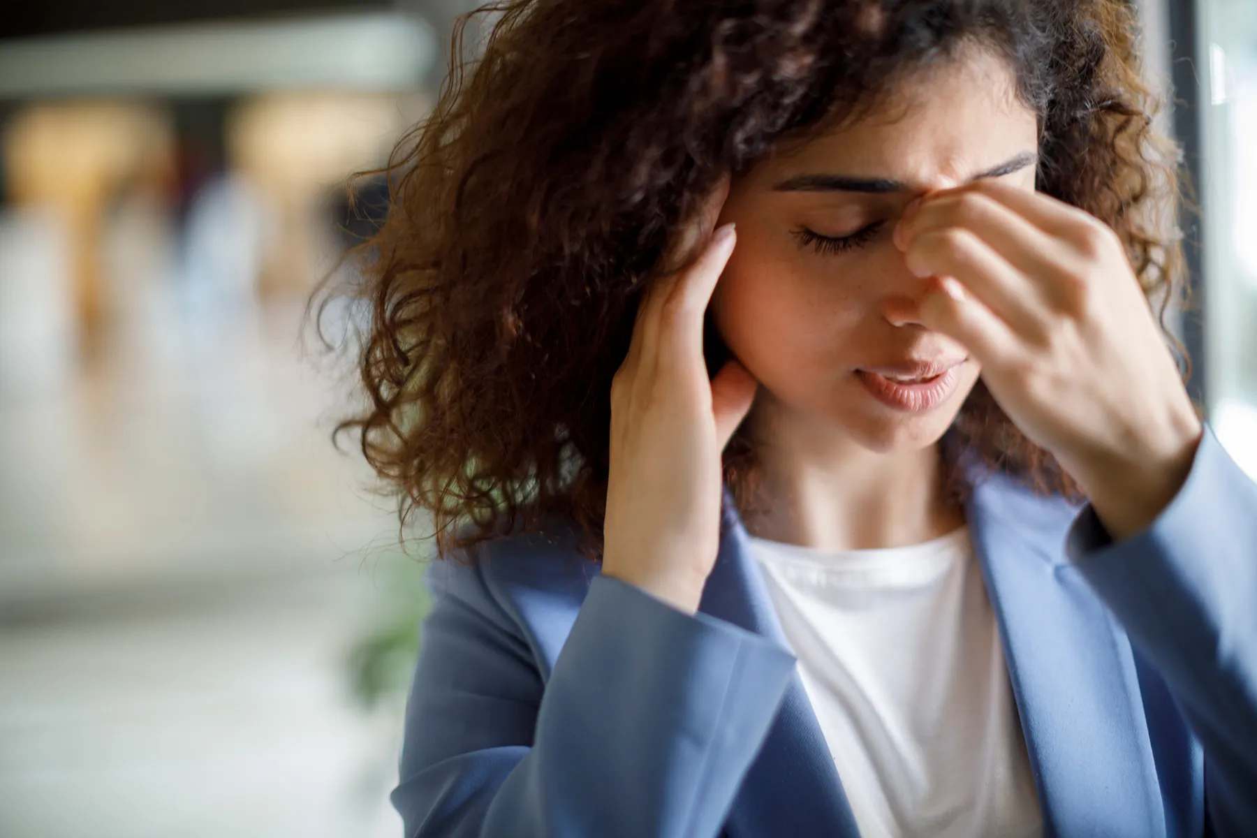 photo of woman with migraine