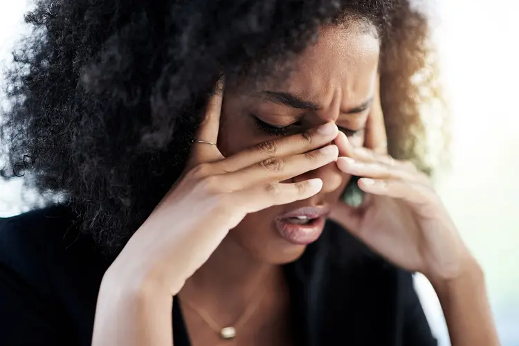 photo of businesswoman experiencing stress