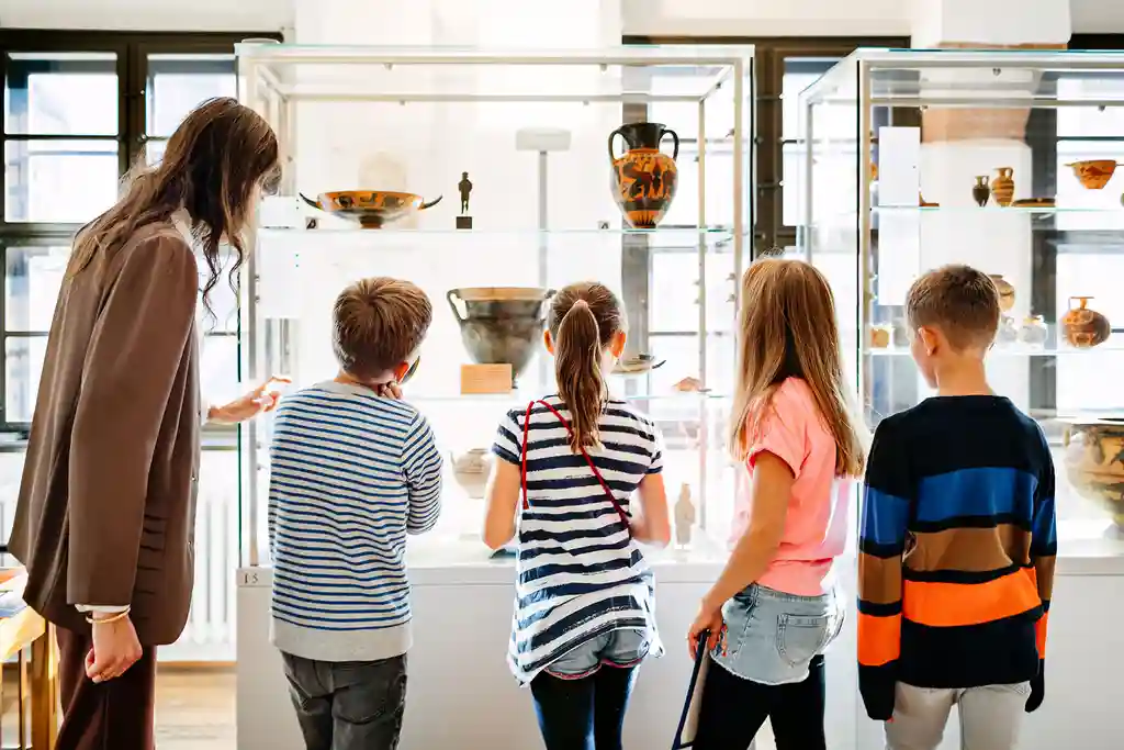 photo of children looking at artifacts in museum